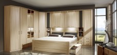 A bedroom with different storage solutions